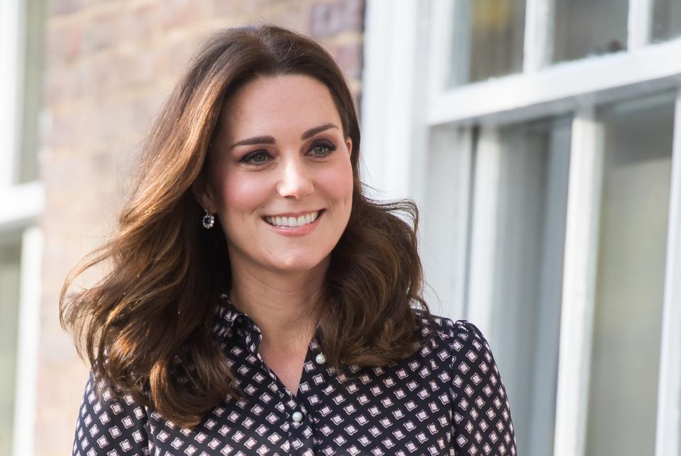 Kate Middleton, in a green Catherine Walker coat, and Prince William celebrated St. Patrick's Day in west London with the 1st Battalion of the Guards regiment.