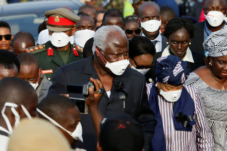 Sierra Leone President Ernest Koroma joined by Liberian President Ellen Johnson Sirleaf are seen on arrival for the burial of victims of the mudslide, at the Paloko cemetery, in Waterloo, Sierra Leone August 17, 2017. REUTERS/Afolabi Sotunde