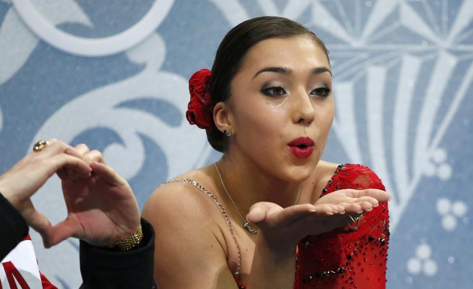 Canada's Gabrielle Daleman blows kisses in the "kiss and cry" area after her figure skating women's short program at the 2014 Sochi Winter Olympics February 19, 2014. REUTERS/Lucy Nicholson (RUSSIA - Tags: OLYMPICS SPORT FIGURE SKATING)