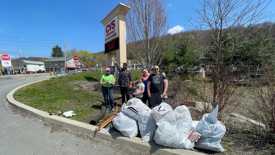 Volunteers pose with bags of trash near the CVS in Honesdale on Saturday, April 24, 2021, during the Pick Up the Poconos event hosted by the Pocono Mountains Visitors Bureau.