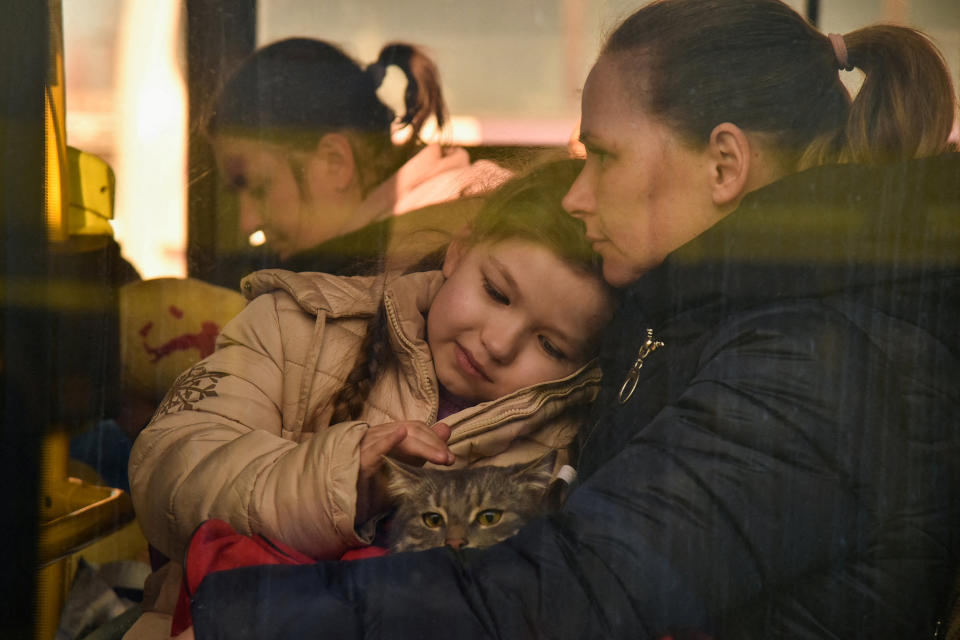 Image: Refugees flee the Russian invasion of Ukraine, in Lviv (Pavlo Palamarchuk / Reuters)