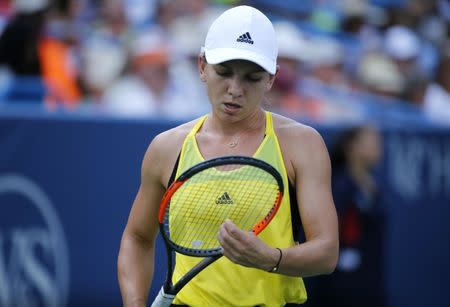 Aug 20, 2017; Mason, OH, USA; Simona Halep paces as she trails in the first set of the womens finals match against Garbine Muguruza during the Western & Southern Open at the Lindner Family Tennis Center. Mandatory Credit: Sam Greene/The Cincinnati Enquirer via USA TODAY NETWORK