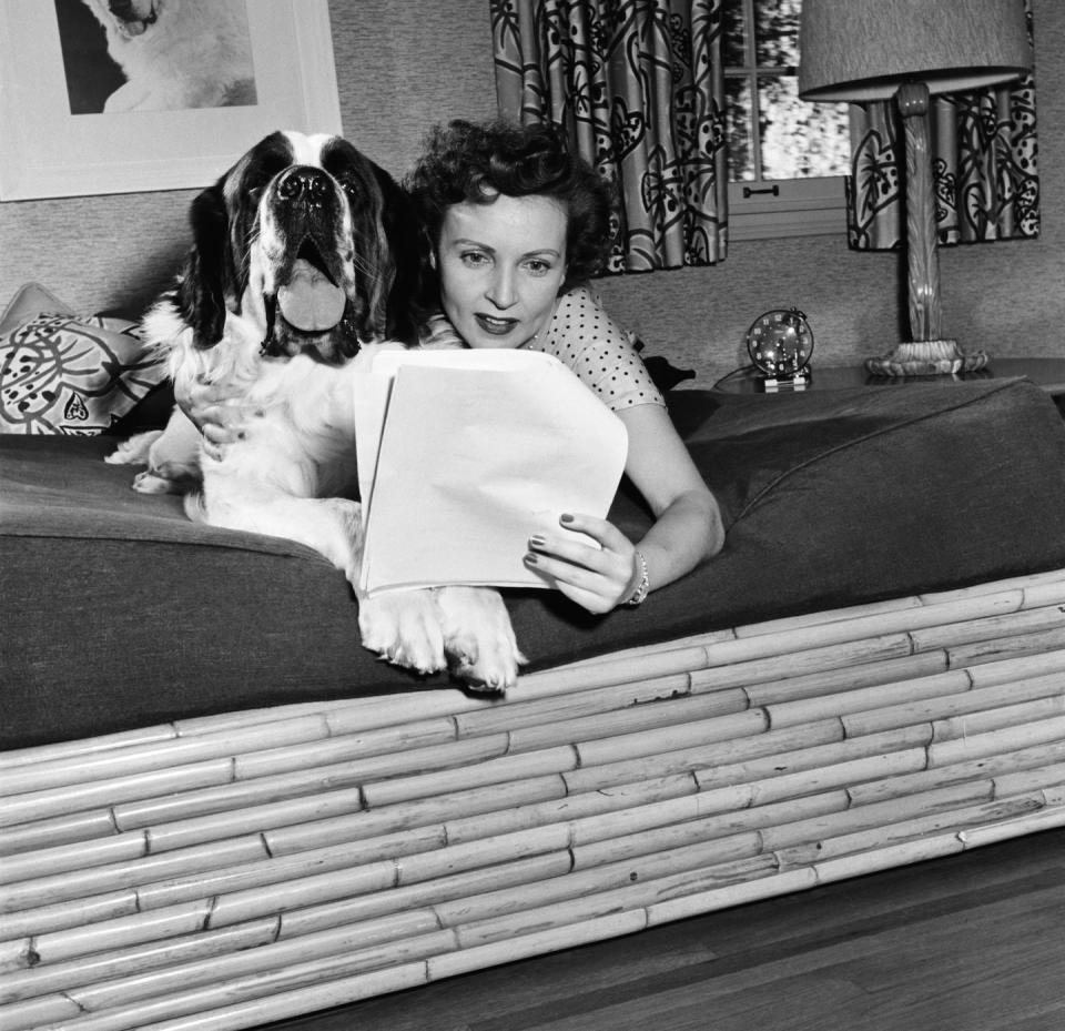 <p>Here, she's spending time at home with her dog, Stormy, before it's time for work. </p>