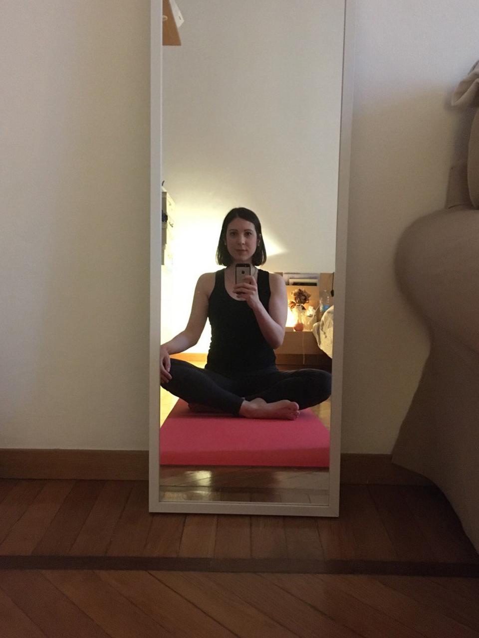 Linda Carbonera, doing yoga in her Milan apartment.