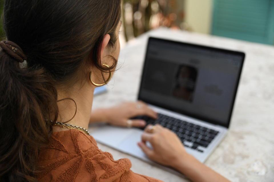 Sexual consent activist, Chanel Contos, browses through her ?Teach Us Consent? website in Sydney, Australia, February 14, 2022. Picture taken February 14, 2022. REUTERS/ Cordelia Hsu