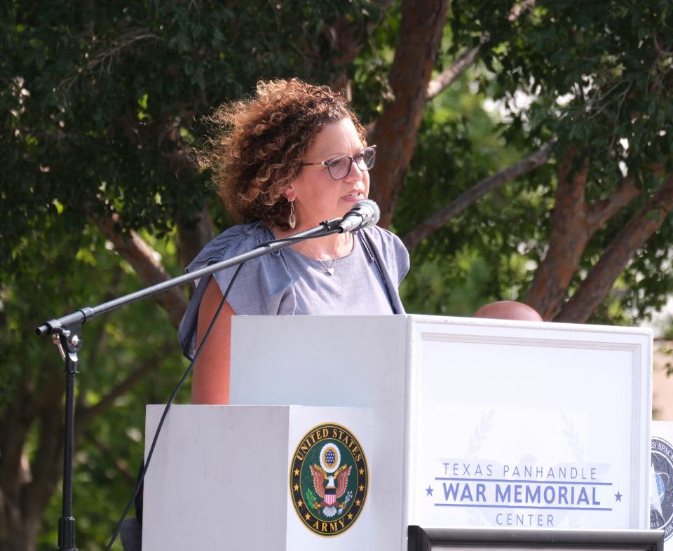 Christy Mattingly speaks about her late husband Matthew Myrick, who died in the line of duty in 2006, during a boat dedication ceremony held in his honor Friday morning at the Texas Panhandle War Memorial Center in Amarillo.