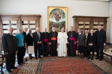 Pope Francis poses with members of the Pontifical Commission for the Protection of Minors during the meeting at the Vatican, September 21, 2017. Osservatore Romano/Handout via REUTERS ATTENTION EDITORS - THIS IMAGE WAS PROVIDED BY A THIRD PARTY. NO RESALES. NO ARCHIVE.