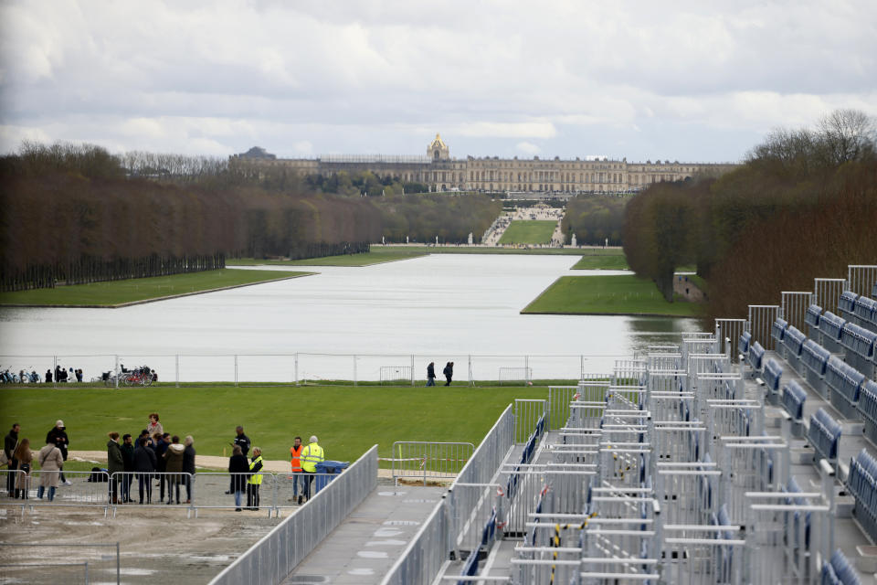 The stands to watch the equestrian sports are seen Friday, March 29, 2024 in the park of the Chateau de Versailles, seen in background, west of Paris. The site will be the venue for equestrian sports at the Paris 2024 Olympic Games. (AP Photo/Thomas Padilla)