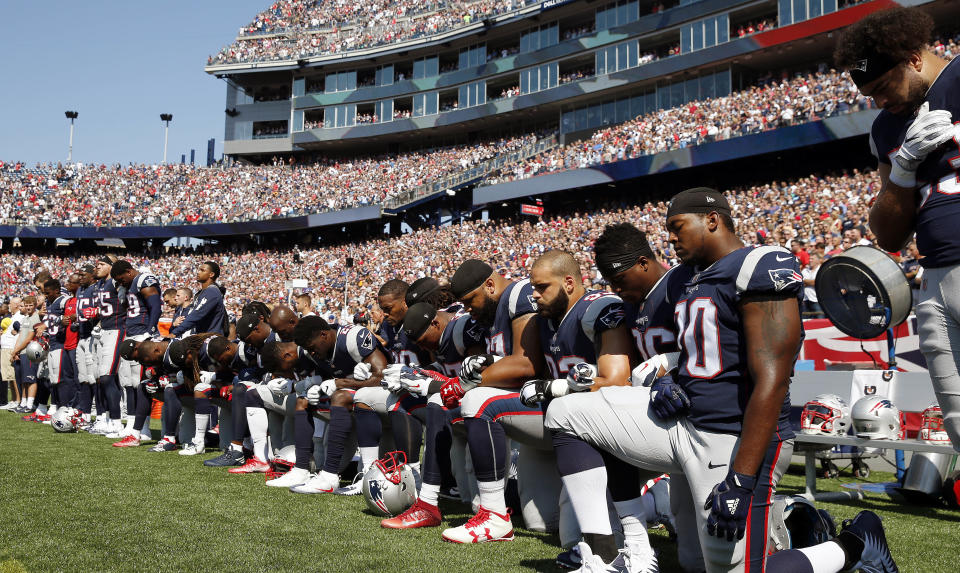 <p>Several New England Patriots players kneel during the national anthem before an NFL football game against the Houston Texans, Sunday, Sept. 24, 2017, in Foxborough, Mass. (AP Photo/Michael Dwyer) </p>