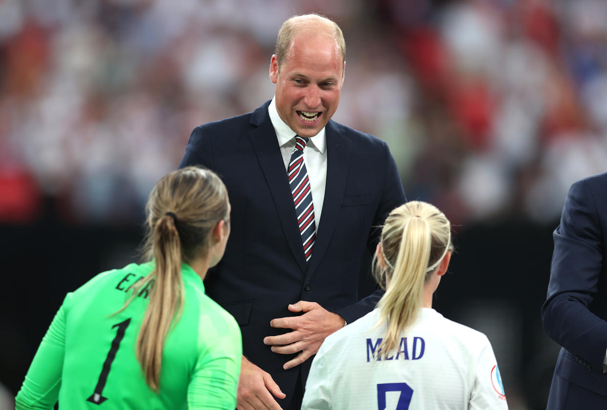 LONDON, ENGLAND - JULY 31: Prince William, Duke of Cambridge, laughs with Mary Earps and Beth Mead of England as they collect their winners medal after the final whistle of the UEFA Women's Euro 2022 final match between England and Germany at Wembley Stadium on July 31, 2022 in London, England. (Photo by Alex Pantling - The FA/The FA via Getty Images)