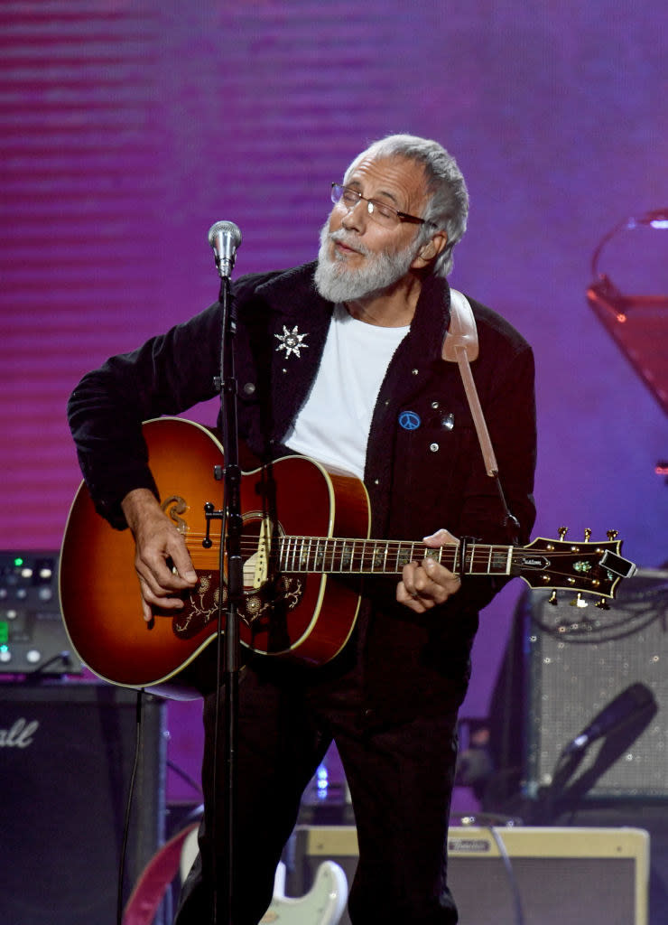 Yusuf Islam performing on stage