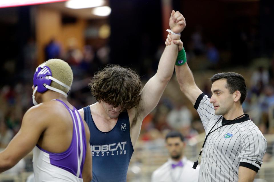 North Port High&#39;s Dominic Joyce has his arm raised after winning the Class 3A 182-pound title at the FHSAA Championships on Saturday evening at Silver Spurs Arena in Kissimmee. Joyce became the second Bobcat to win the title.