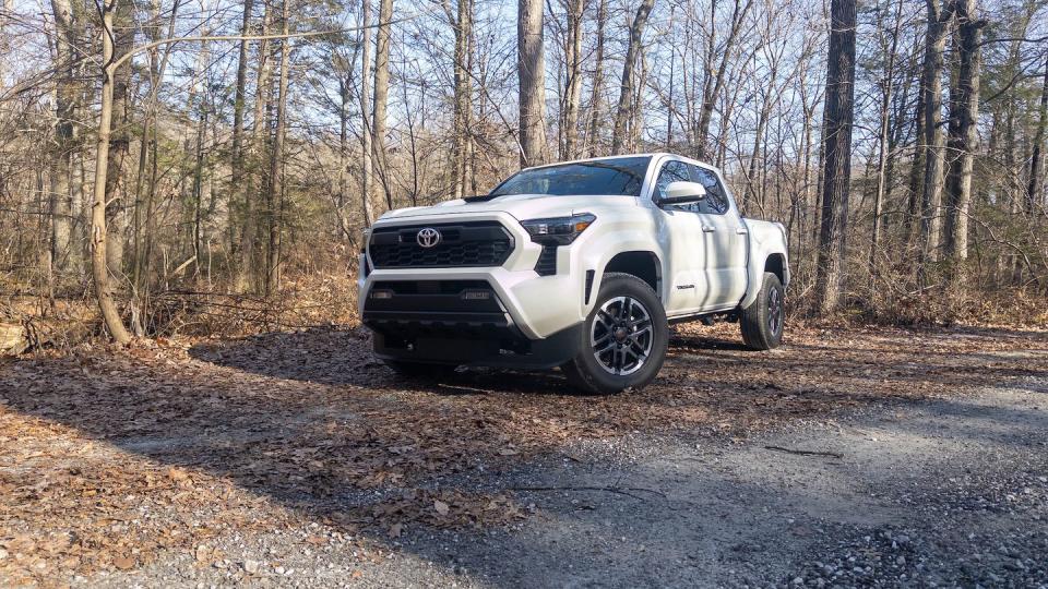 a white car on a dirt road