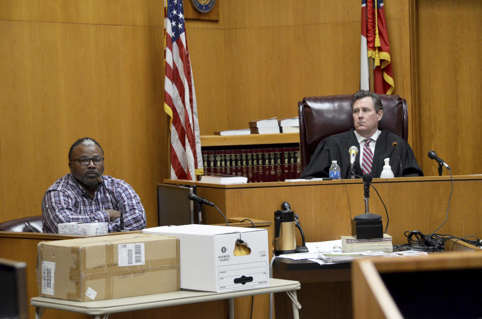 Shon Blackwell, left, testifies on Day 5 of the capital murder trial of Willie Cory Godbolt at the Pike County Courthouse in Magnolia, Miss., Wednesday, Feb. 19, 2020. A witness testified Tuesday that Godbolt, on trial in the 2017 shooting deaths of eight people, showed up at her house the night of the killings and that he was carrying two rifles and told her that he had killed a sheriff's deputy. Blackwell's son, 18-year-old Jordan Blackwell, is one of the eight people Godbolt is accused of killing in May 2017 in Brookhaven, Miss. (Donna Campbell/The Daily Leader via AP, Pool)