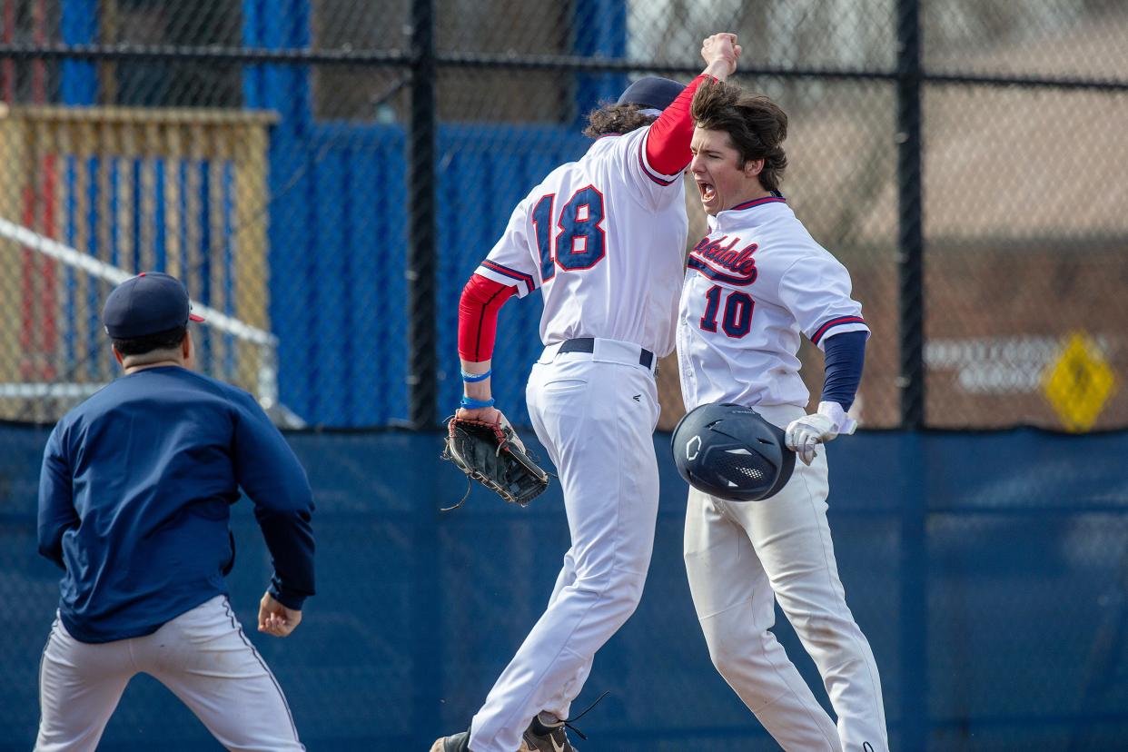 Brookdale's (#10) Ryan Cole celebrates his homerun with (#18) Rocko Brzezniak during the third inning of the Rowan College of South Jersey - Cumberland vs. Brookdale baseball game at Brookdale Community College in Lincroft, NJ Monday, March 18, 2024.