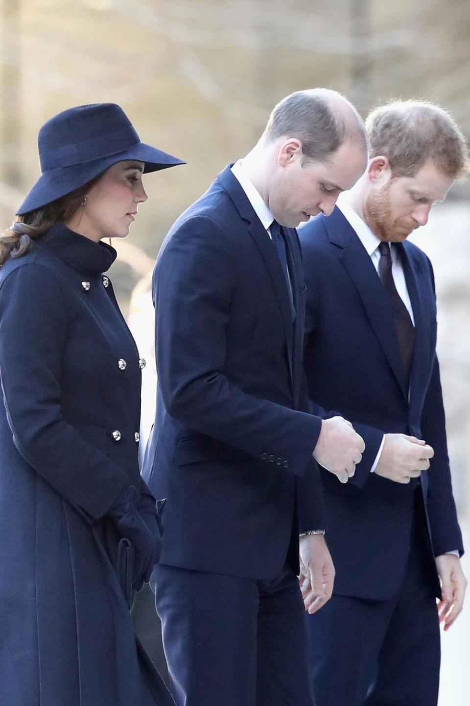 The Duke and Duchess of Cambridge and Prince Harry arrive for the service