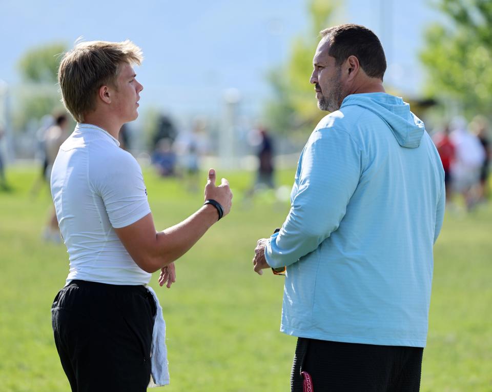 Isaac Wilson talks with his dad Mike Wilson during a 7-on-7 passing league game in Layton on Friday, June 9, 2023. | Scott G Winterton, Deseret News