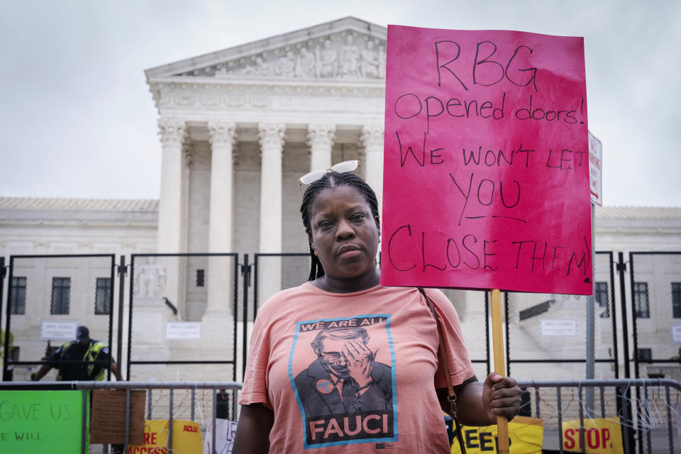 Ekerin Shopshire, of Washington, poses for a portrait as she joins abortion rights demonstrators, Saturday, May 14, 2022, outside the Supreme Court in Washington, during protests across the country. "I foresee a lot of traveling, crossing of state lines to get the medical attention people may want or need. I see an increase in deaths, for women who aren't able to easily cross those state lines for the medical help they need," she said. "The back-alley abortions are going to make a comeback, that's just what's going to happen." (AP Photo/Jacquelyn Martin)