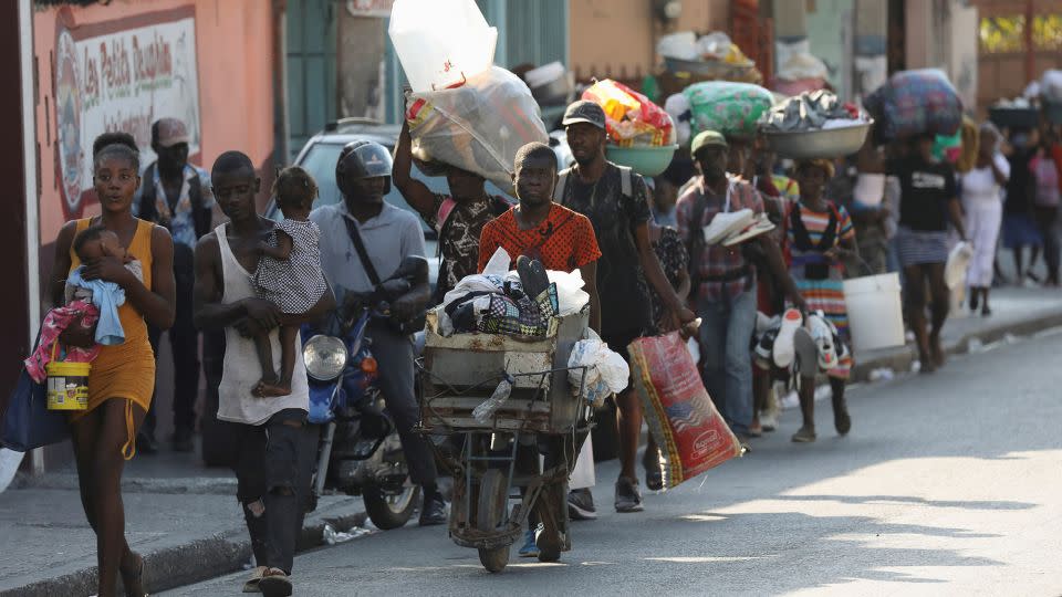 People flee their homes as police confront armed gangs in Port-au-Prince, Haiti, February 29, 2024. - Ralph Tedy Erol/Reuters