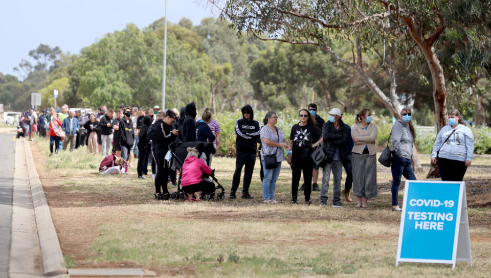  People queuing at the COVID-19 testing site at Parafield Airport in Adelaide on Monday. Source: Getty