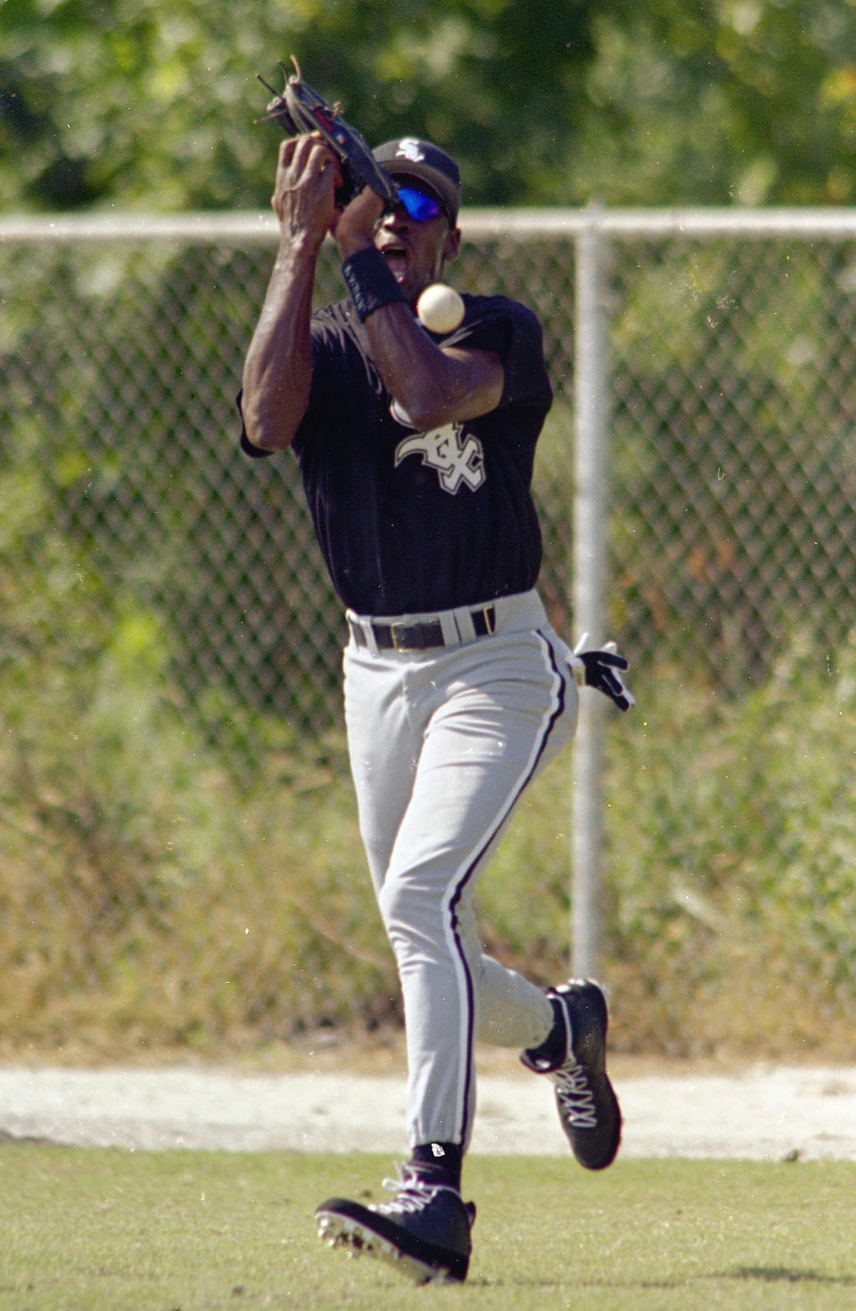 Michael Jordan drops a fly ball during the first day of practice at the Chicago White Sox's Instructional League in Sarasota, Fla., Sept. 23, 19 (AP Photo/Chris O'Meara)