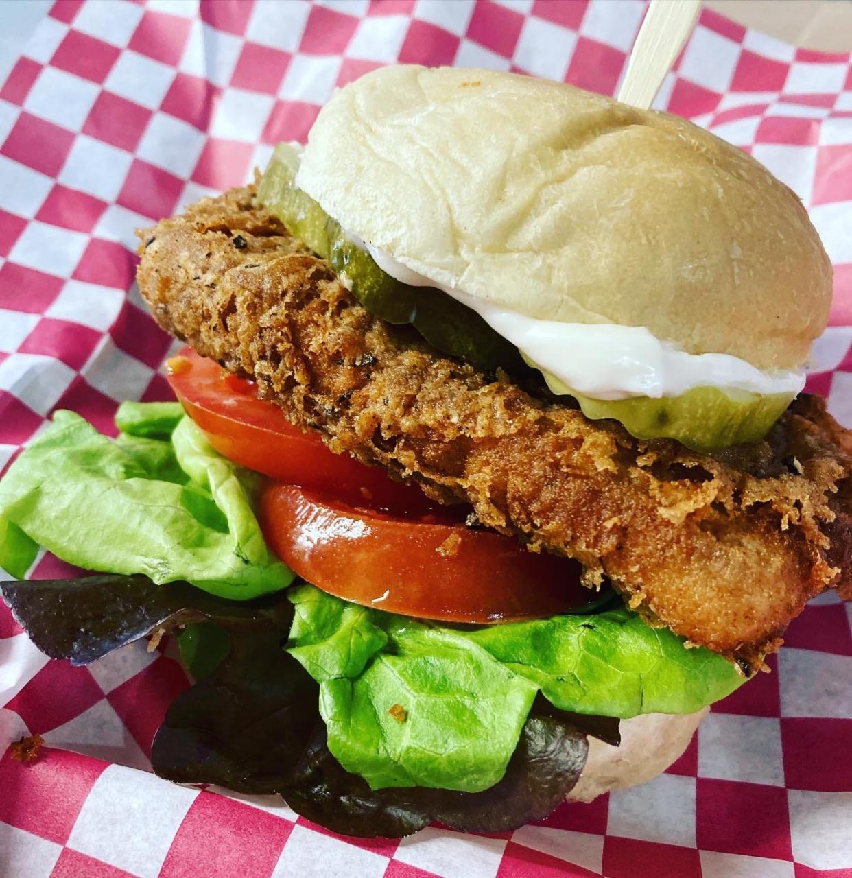 The Cluckin' Good is a plant-based "chicken" sandwich and one of the most popular items on The Smokin' Onion's menu.