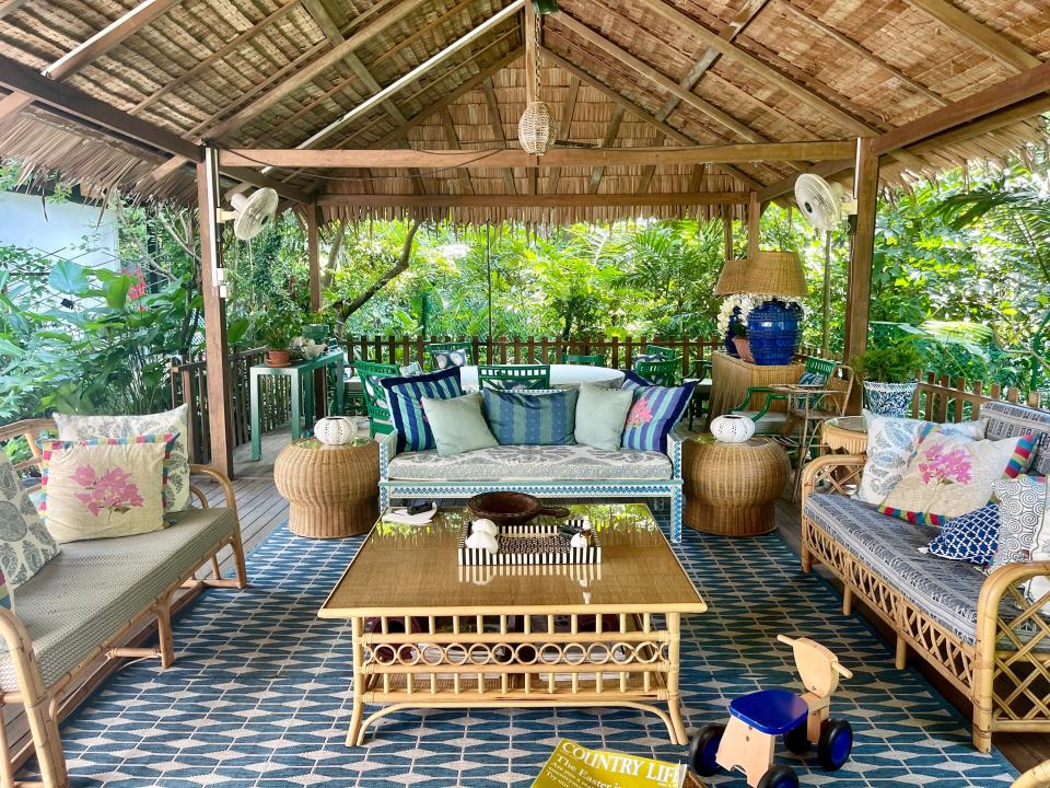 Hay built a traditional attap shelter in the backyard, which serves as an outdoor gathering spot for her family