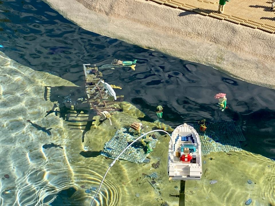 The sunken shipwreck underwater at Miniland is one of Ross' favorite projects. She has even been able to add mermaids around it.