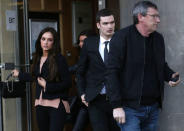 Sunderland soccer player Adam Johnson (C) leaves with his girlfriend Stacey Flounders (L) Bradford Crown Court in Bradford, Britain February 10, 2016. REUTERS/Andrew Yates