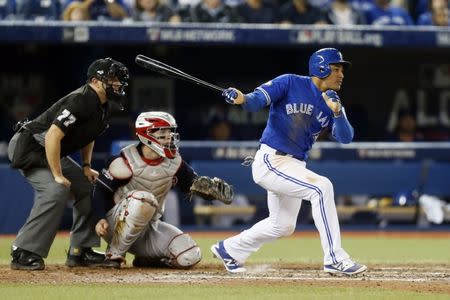 Toronto Blue Jays right fielder Ezequiel Carrera (3) hits a triple during the eighth inning against the Cleveland Indians in game four of the 2016 ALCS playoff baseball series at Rogers Centre. Mandatory Credit: John E. Sokolowski-USA TODAY Sports