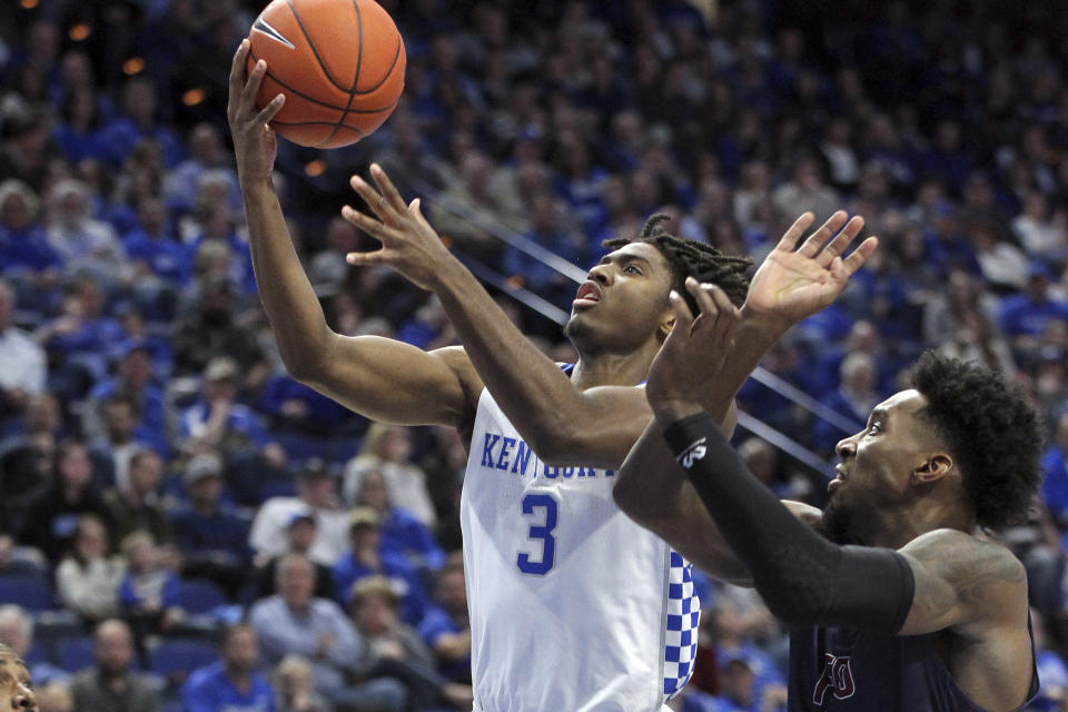 Kentucky's Tyrese Maxey (3) shoots while defended by Fairleigh Dickinson's Kaleb Bishop (12) during the second half of an NCAA college basketball game in Lexington, Ky., Saturday, Dec. 7, 2019. (AP Photo/James Crisp)