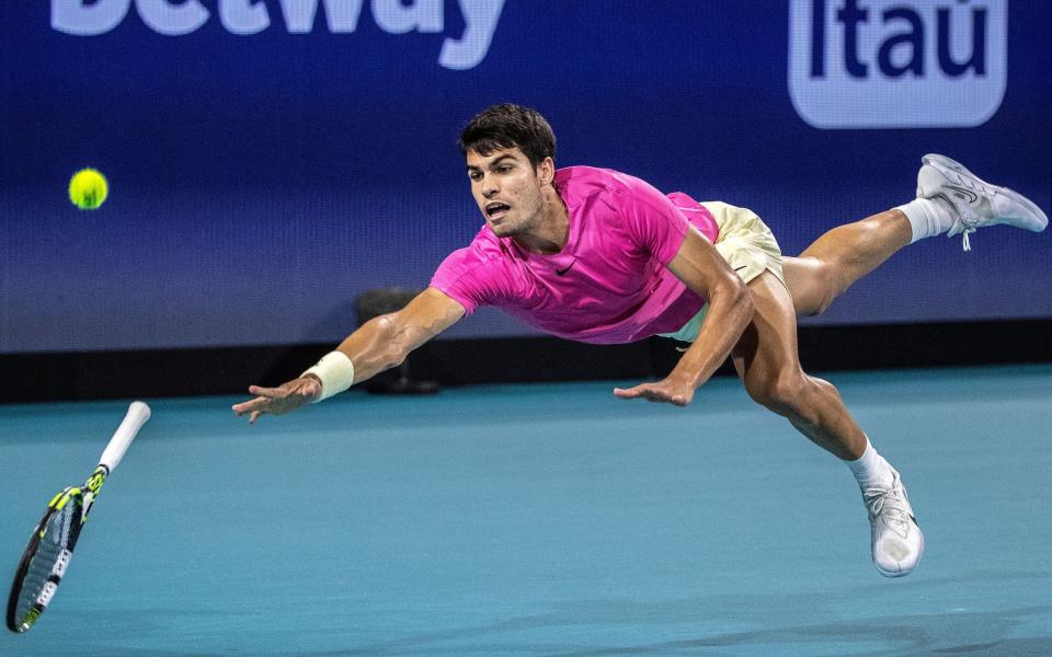 Carlos Alcaraz dives during his match with Jannik Sinner at the 2023 Miami Open - Rafael Nadal fears grow after Monte Carlo Masters withdrawal - Shutterstock/Cristobal Herrera