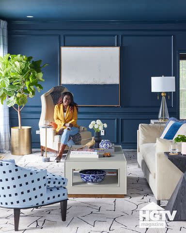 <p>Dylan Chandler</p> Tiffany Brooks poses in her renovated living room.