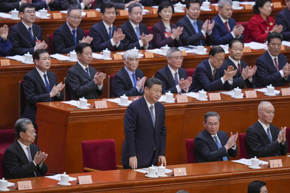 Chinese President Xi Jinping, center front, attends the opening session of the Chinese People's Political Consultative Conference in the Great Hall of the People in Beijing, Monday, March 4, 2024. (AP Photo/Tatan Syuflana)