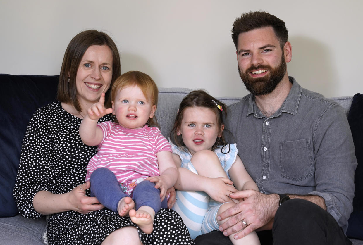 Opal Sandy (second left), who was born completely deaf but can now hear unaided for the first time after receiving gene therapy as part of a medical trial, is seen with her mother Jo, father James and sister Nora at their home in Eynsham, England, May 7, 2024. / Credit: Andrew Matthews/PA Images/Getty