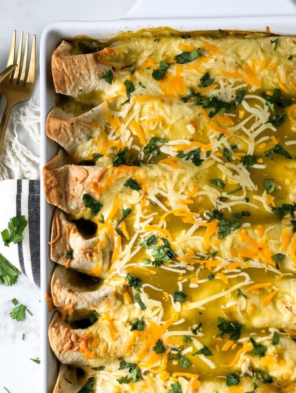 <p>Fetty's Food Blog</p><p>These enchiladas are filled with a creamy chicken, corn and rice mixture. Completely smothered in green chile enchilada sauce. And of course, plenty of cheese! </p><p><strong>Get the recipe: <a href="https://fettysfoodblog.com/chicken-enchiladas-with-green-chile-sauce/" rel="nofollow noopener" target="_blank" data-ylk="slk:Chicken Enchiladas with Green Chile Sauce;elm:context_link;itc:0;sec:content-canvas" class="link ">Chicken Enchiladas with Green Chile Sauce</a></strong></p>