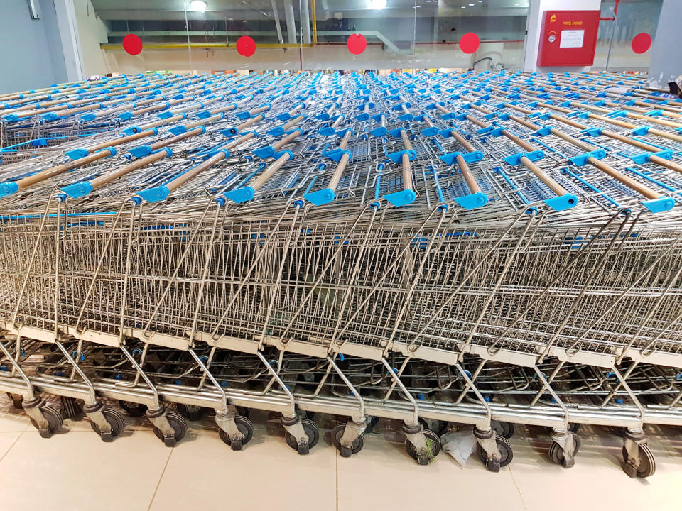 several grocery store carts in multiple rows