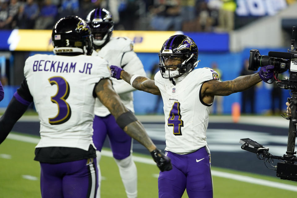 Baltimore Ravens wide receiver Zay Flowers (4) celebrates his touchdown run with wide receiver Odell Beckham Jr. (3) during the second half of an NFL football game Sunday, Nov. 26, 2023, in Inglewood, Calif. (AP Photo/Ryan Sun)