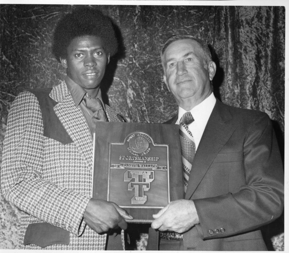 Texas Tech coach JT King presents the Donny Anderson sportsmanship award to cornerback Kenneth Wallace in 1973, the year the Red Raiders went 11-1 and beat Tennessee in the Gator Bowl. Wallace was co-winner of the award with linebacker George Herro.