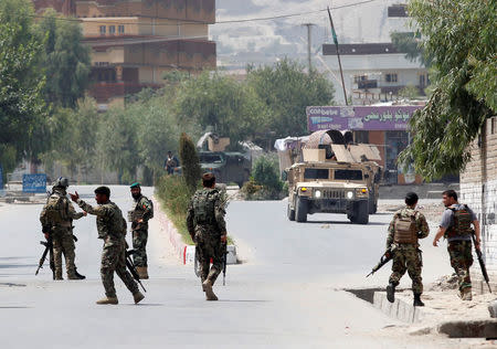 Afghan National Army (ANA) soldiers arrive at the site of gunfire and attack in Jalalabad city, Afghanistan July 11, 2018. REUTERS/Parwiz