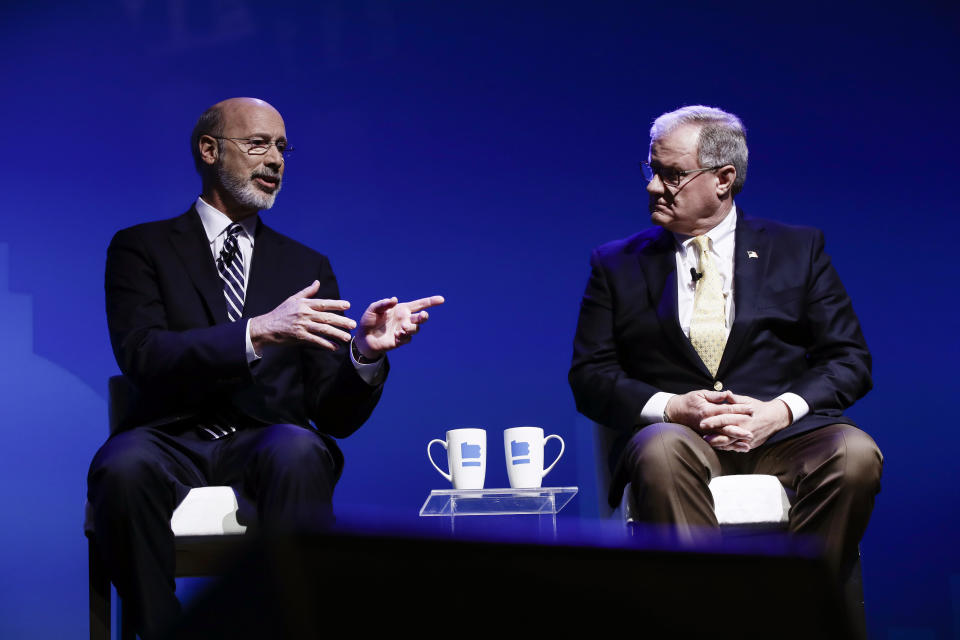 Democratic Gov. Tom Wolf, left, and Republican Scott Wagner take part in a gubernatorial debate in Hershey, Pa., Monday, Oct. 1, 2018. The debate is hosted by the Pennsylvania Chamber of Business and Industry. (AP Photo/Matt Rourke)