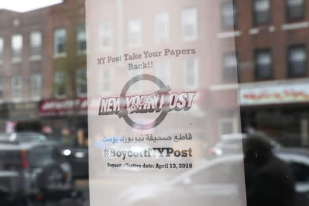 A sign calling for the boycott of the New York Post newspaper is seen in the window of the Yemeni American Merchants Association in the Brooklyn Borough of New York, U.S., April 15, 2019. REUTERS/Shannon Stapleton