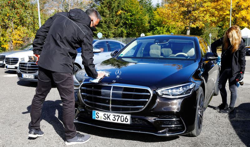 Employees of Daimler clean a new Mercedes-Benz S-Class limousine near Immendingen