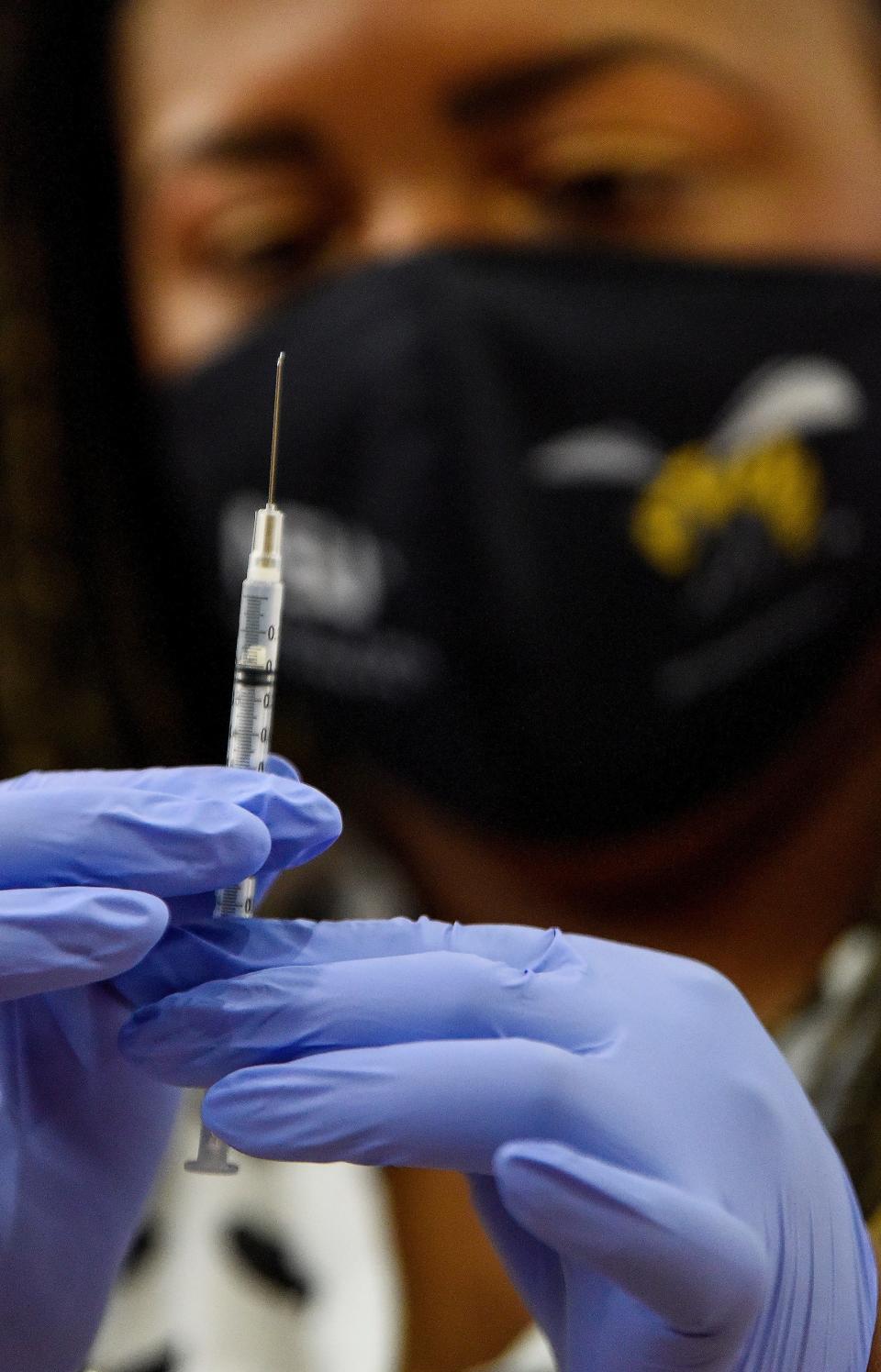 Nurse Practitioner Ashley Tippins gives COVID-19 vaccines during a Vaccine Clinic for students, aged 5-11, on the ASU campus in Montgomery, Ala., on Friday January 21, 2022. The clinic was put on in partnership between Alabama State University, Montgomery Public Schools and the Alabama Department of Public Health. 