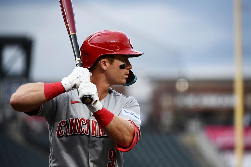 Cincinnati Reds' Matt McLain swings in the on-deck circle in the first inning of a baseball game against the Colorado Rockies Tuesday, May 16, 2023, in Denver.