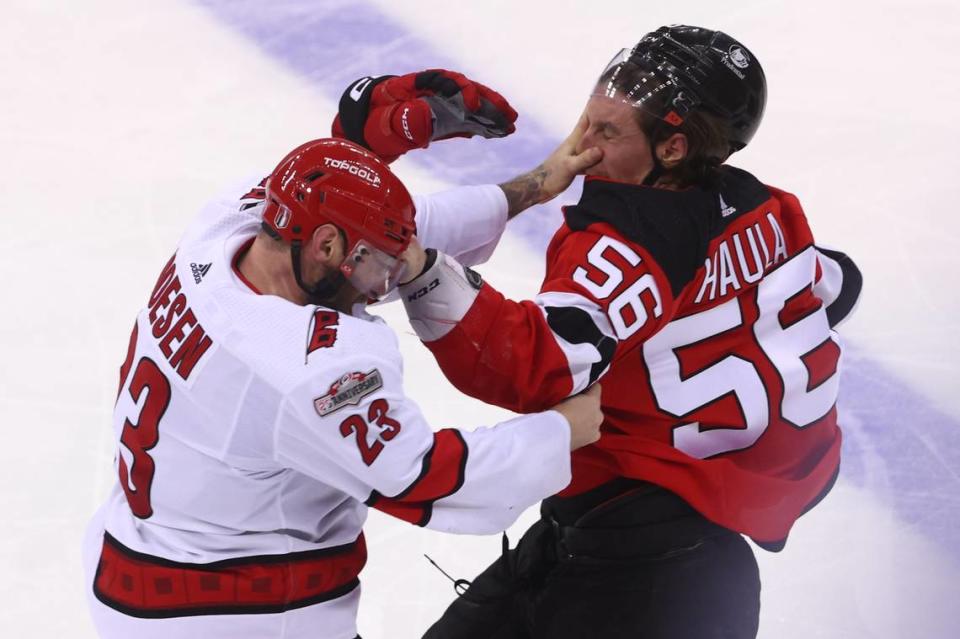 Carolina Hurricanes right wing Stefan Noesen (23) and New Jersey Devils left wing Erik Haula (56) fight during the third period in game three of the second round of the 2023 Stanley Cup Playoffs at Prudential Center.