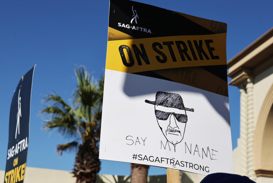 LOS ANGELES, CALIFORNIA - OCTOBER 16: People carry signs as striking SAG-AFTRA members and supporters picket outside Paramount Studios on day 95 of their strike against the Hollywood studios on October 16, 2023 in Los Angeles, California. Contract negotiations between the actors union and the Alliance of Motion Picture and Television Producers (AMPTP) broke down last week in the strike which began July 14. (Photo by Mario Tama/Getty Images)