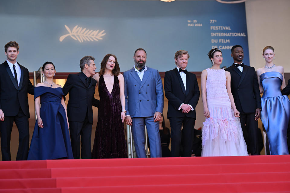 CANNES, FRANCE - MAY 17: Greek director Yorgos Lanthimos (C), US actor Willem Dafoe (L-3), British actor Joe Alwyn (L), US actress Hunter Schafer (R), US actress Emma Stone (L-4), US actress Hong Chau (L-2), Mamoudou Athie (R-2) and Margaret Qualley (R-3) attend the screening of the film 'Kinds Of Kindness' at the 77th Film Festival at Palais des Festivals in Cannes, France on May 17, 2024. (Photo by Mustafa Yalcin/Anadolu via Getty Images)