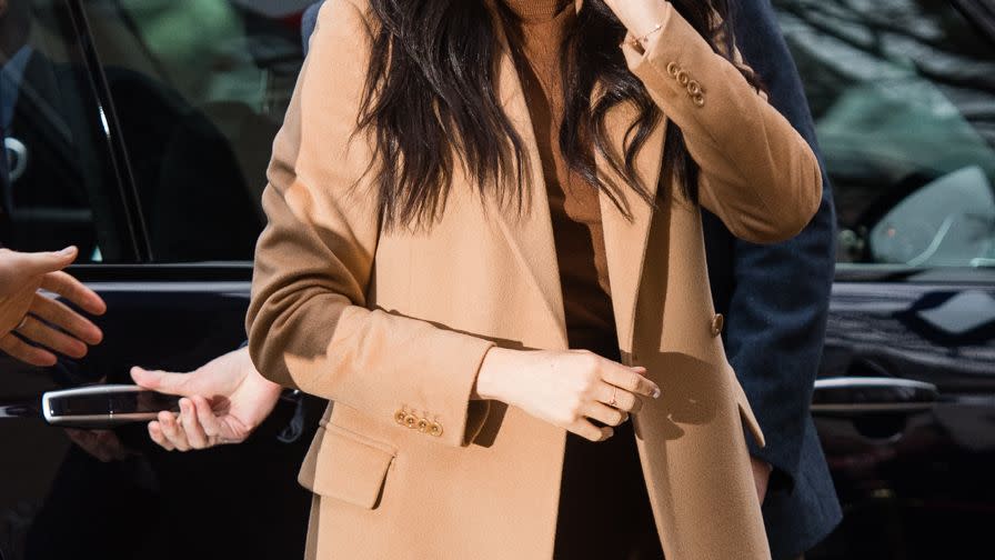 meghan markle wears a camel coat at a royal appearance in a guide to the best camel coats