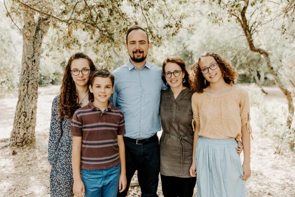 Ryan Corbett with his wife and their three children (Sourced/ The Independent)